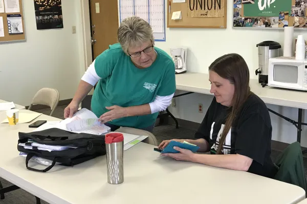 Cathy Malvin left) and Cindy Ramsey prepare for a worksite blitz
