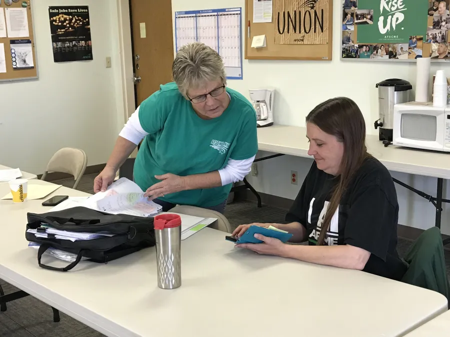 Cathy Malvin left) and Cindy Ramsey prepare for a worksite blitz